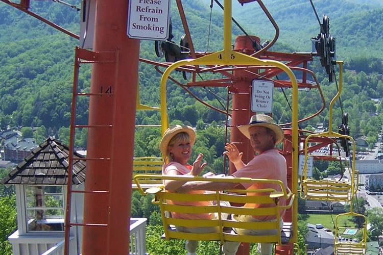 People in a chair lift in the smoky mountains.